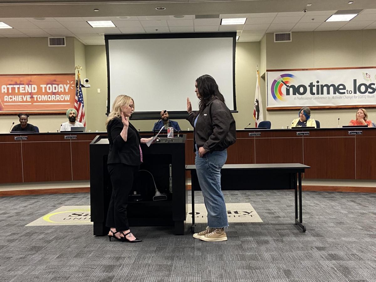 Student Board Member Liliana “Gracie” Miller Segura was sworn in by Board Member Christina Pritchett